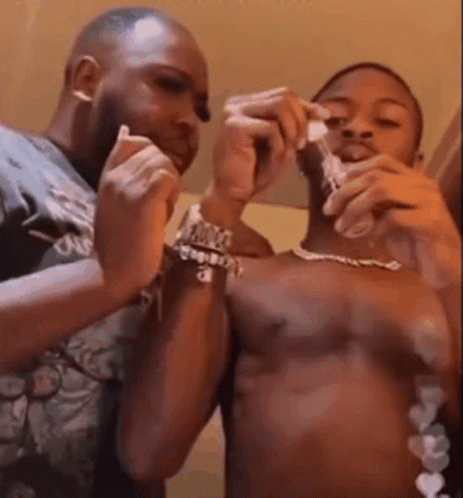 Shirtless Men Shaving Each Other