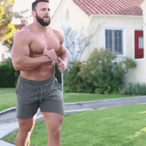 Shirtless Muscular Bearded Man Running Down Sidewalk GIF