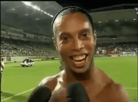 Shirtless Soccer Player Smiling Talking Into Microphone