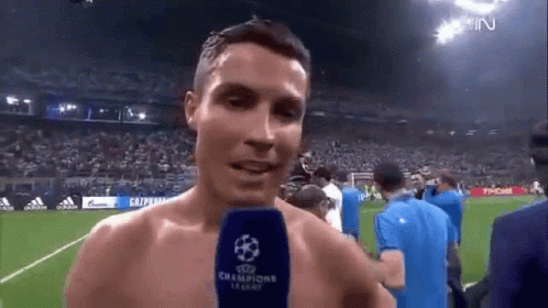 Shirtless Soccer Player Talking Into Microphone