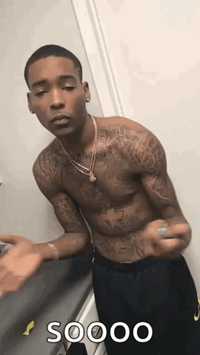 Shirtless Tattooed Man at Door