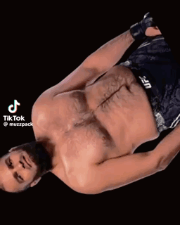 Shirtless UFC Fighter Laying Down With Lightning Eyes GIF