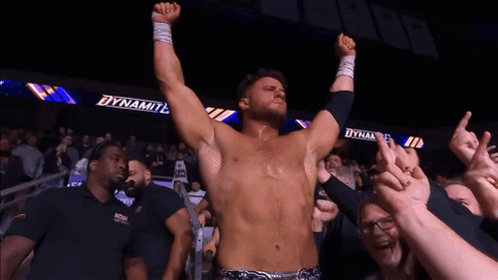 Shirtless Wrestler Before Crowd With Dynamite