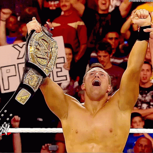 Shirtless Wrestler Holding Championship Belt