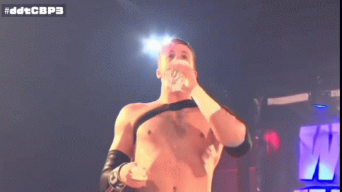 Shirtless Wrestler Holding Microphone