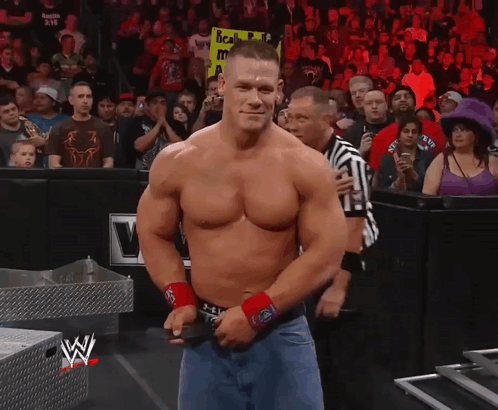 Shirtless Wrestler Holding Scala Sign GIF