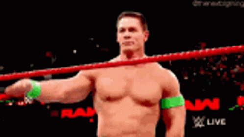 Shirtless Wrestler Saluting in Ring
