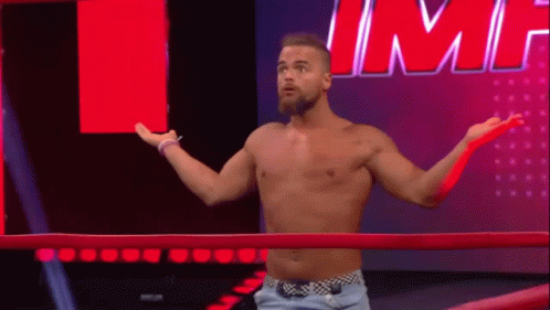 Shirtless Wrestler Standing In Ring GIF