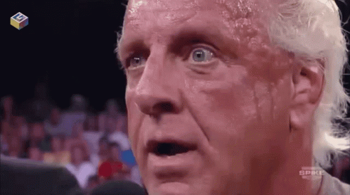 Shirtless Wrestler Talking Into Microphone