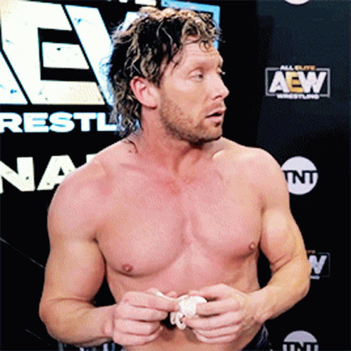 Shirtless Wrestler With AEW Sign