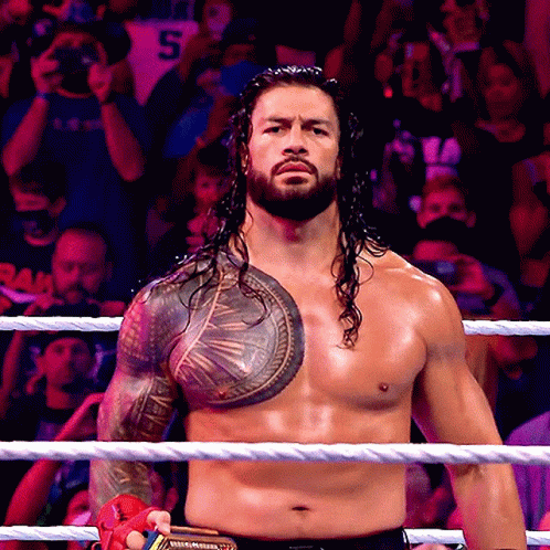 Shirtless Wrestler With Chest Tattoo in Rope Ring