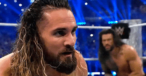 Shirtless Wrestler with Long Hair and Beard in Ring
