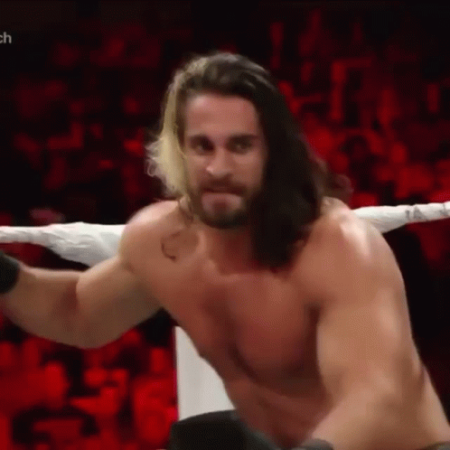 Shirtless Wrestler with Long Hair and Beard in Ring