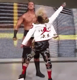 Shirtless Wrestlers White Jacket Chinese Writing GIF
