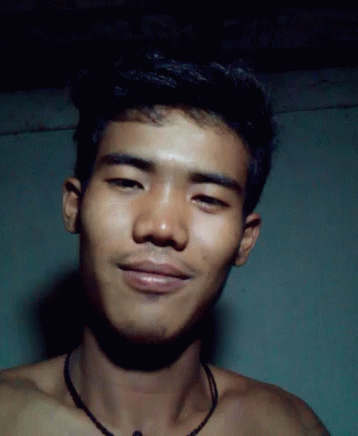 Shirtless Young Man With Necklace Looking At Camera GIF
