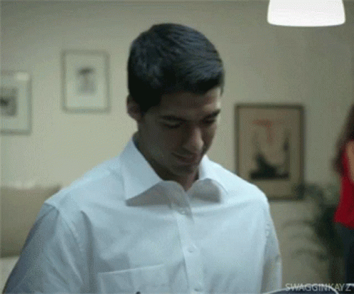 Shocked Luis Suarez Packing Shoes GIF