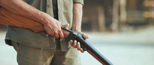 Man Checking His Shotgun GIF