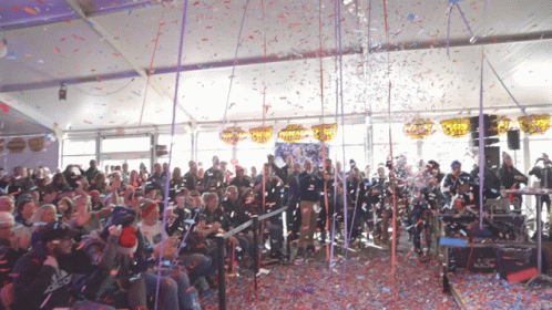 Showering The Confetti Cannon On The Crowd GIF