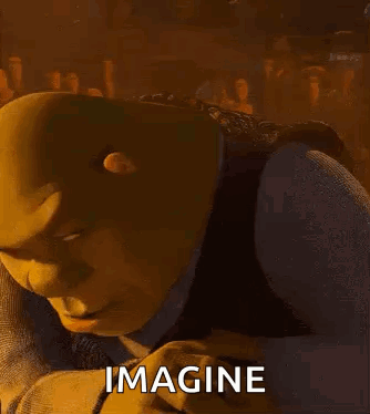 Shrek From Shrek Is Smiling And Looking At The Camera With The Words `` Imagine '' Written Below Him . GIF