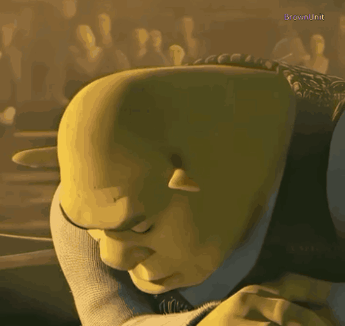 Shrek From The Animated Movie Shrek Is Looking Down With His Eyes Closed GIF