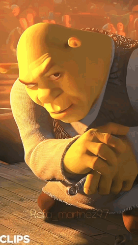 Shrek From The Movie Shrek Is Kneeling Down With His Hands Folded GIF