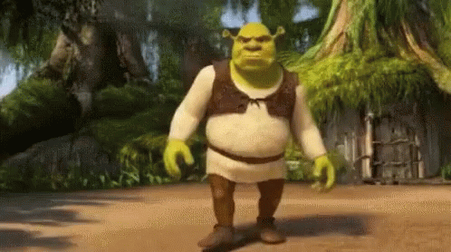 Shrek From The Movie Shrek Is Walking On A Dirt Path GIF