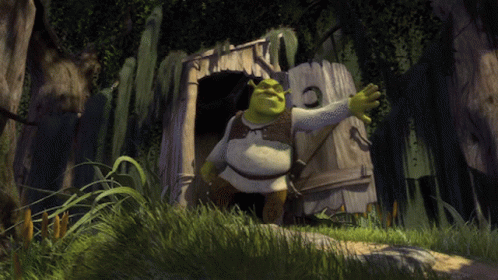 Shrek Is Standing In Front Of A Wooden Shack In The Woods GIF