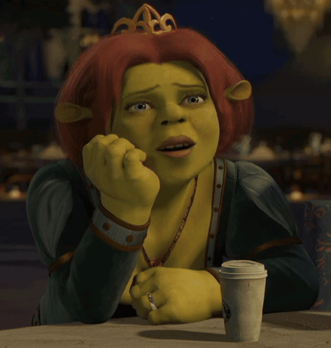 Shrek Sitting at Table With Coffee