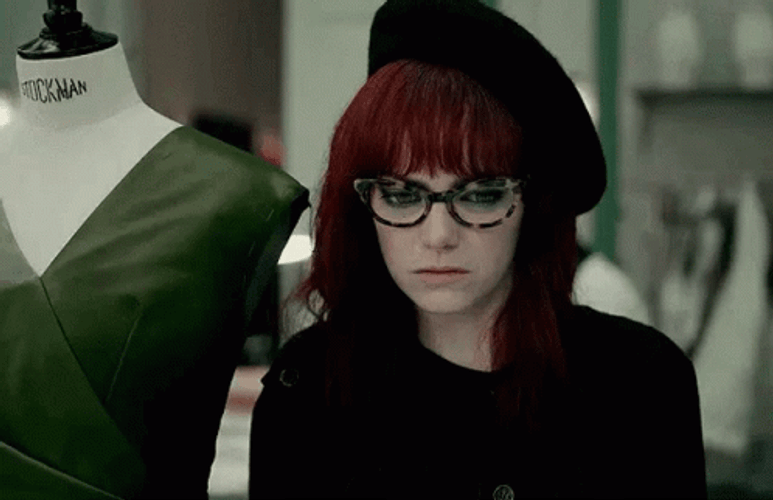 Shy Emma Stone Cruella Smile GIF