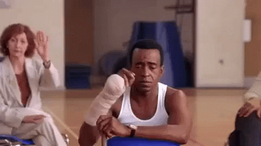 Shy Man Slowly Raising Hand GIF