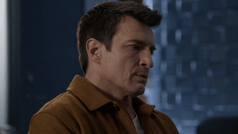 Side Profile Sad Nathan Fillion GIF