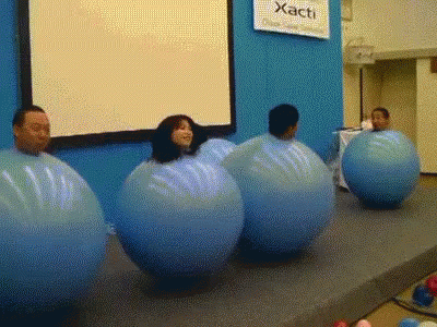 Sign Saying Xacti Above Group Of People GIF