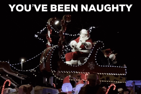 Sign Says You've Been Naughty Next To Santa Sleigh