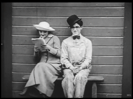 Silent Film Couple Harold Lloyd Sitting GIF