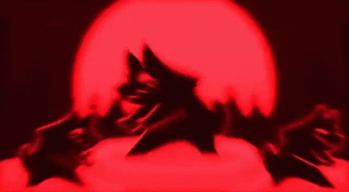 Silhouette Covering Face in Front of Red Light