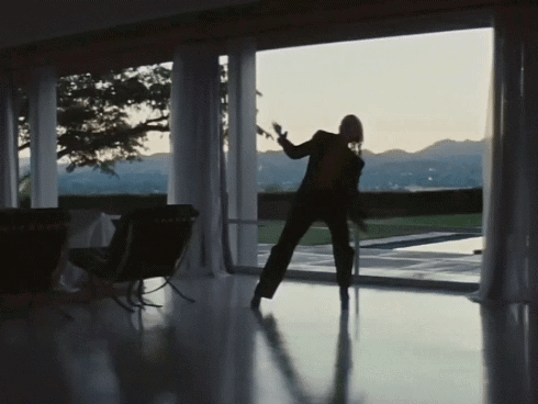 Silhouette Dancing In Front Of Large Window GIF