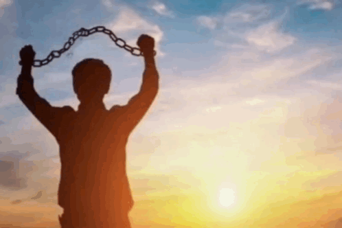 Silhouette Man Holding Chain at Sunset