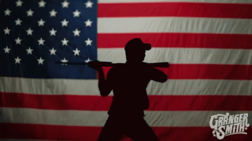 Silhouette Man Holding Gun in Front of American Flag Granger Smith
