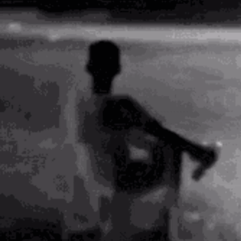 Silhouette Man on Beach Holding Soda