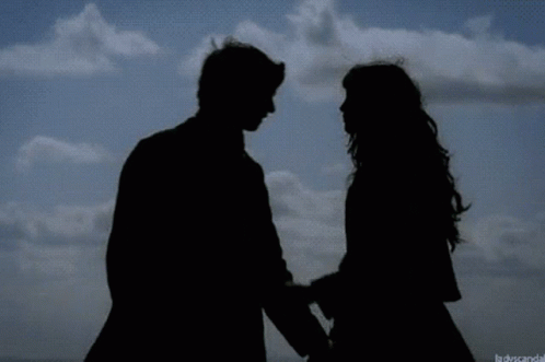 Silhouette Of Man And Woman Kissing GIF