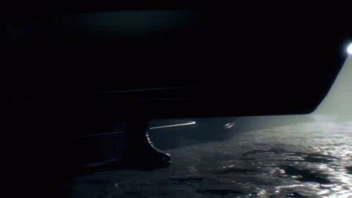 Silhouette of Man Standing Next to Car