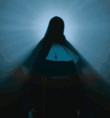 Silhouette of Nun With Cross Necklace
