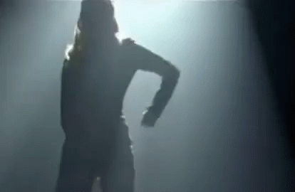 Silhouette Of Woman Dancing In Dark Room With Light GIF