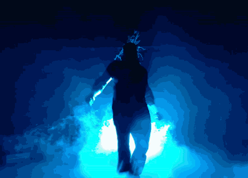 Silhouette Standing in Dark Room