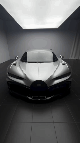 Silver Bugatti Sports Car Parked in Dark Room