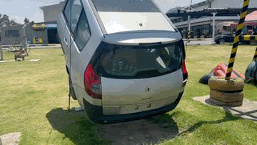 Silver Car Stuck in Park Grass