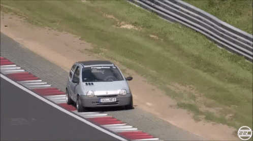 Silver Car With License Plate FSL NB8 On Race Track GIF