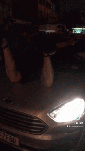 Silver Car with License Plate Saying U
