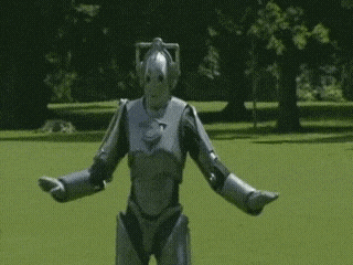 Silver Robot Standing in Field