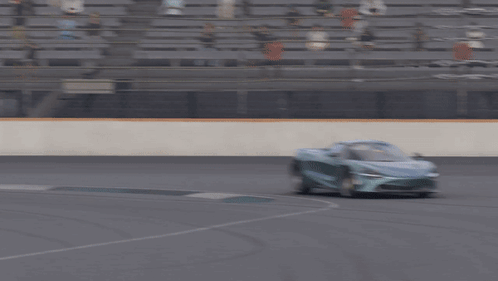 Silver Sports Car Driving Race Track